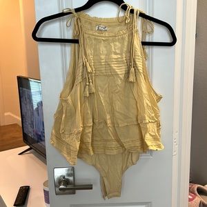 Yellow FreePeople bodysuit with connected top.Lightly worn & slightly wrinkled